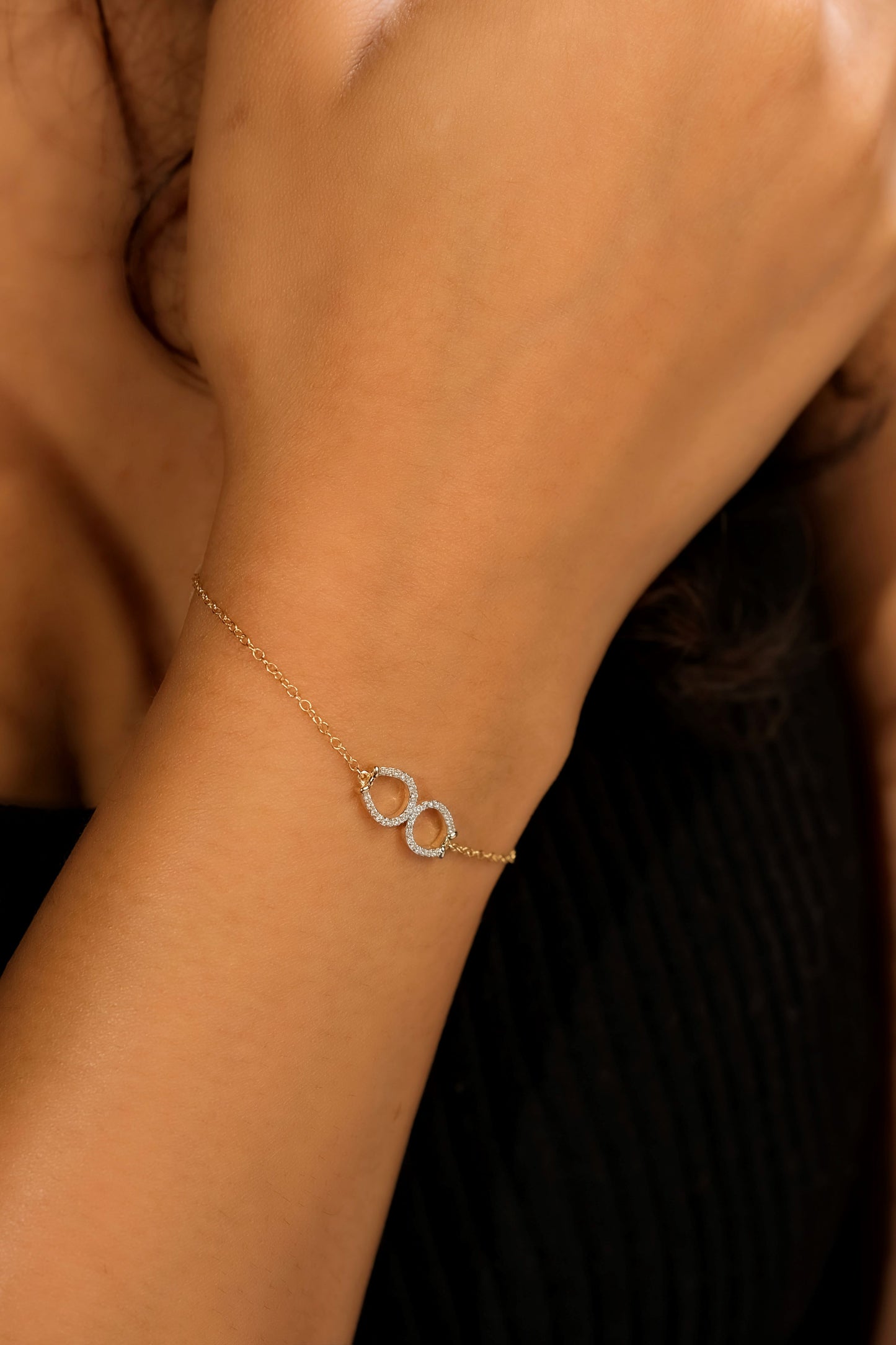 Lifestyle Image - Two Horseshoe Diamond Gold Bracelet