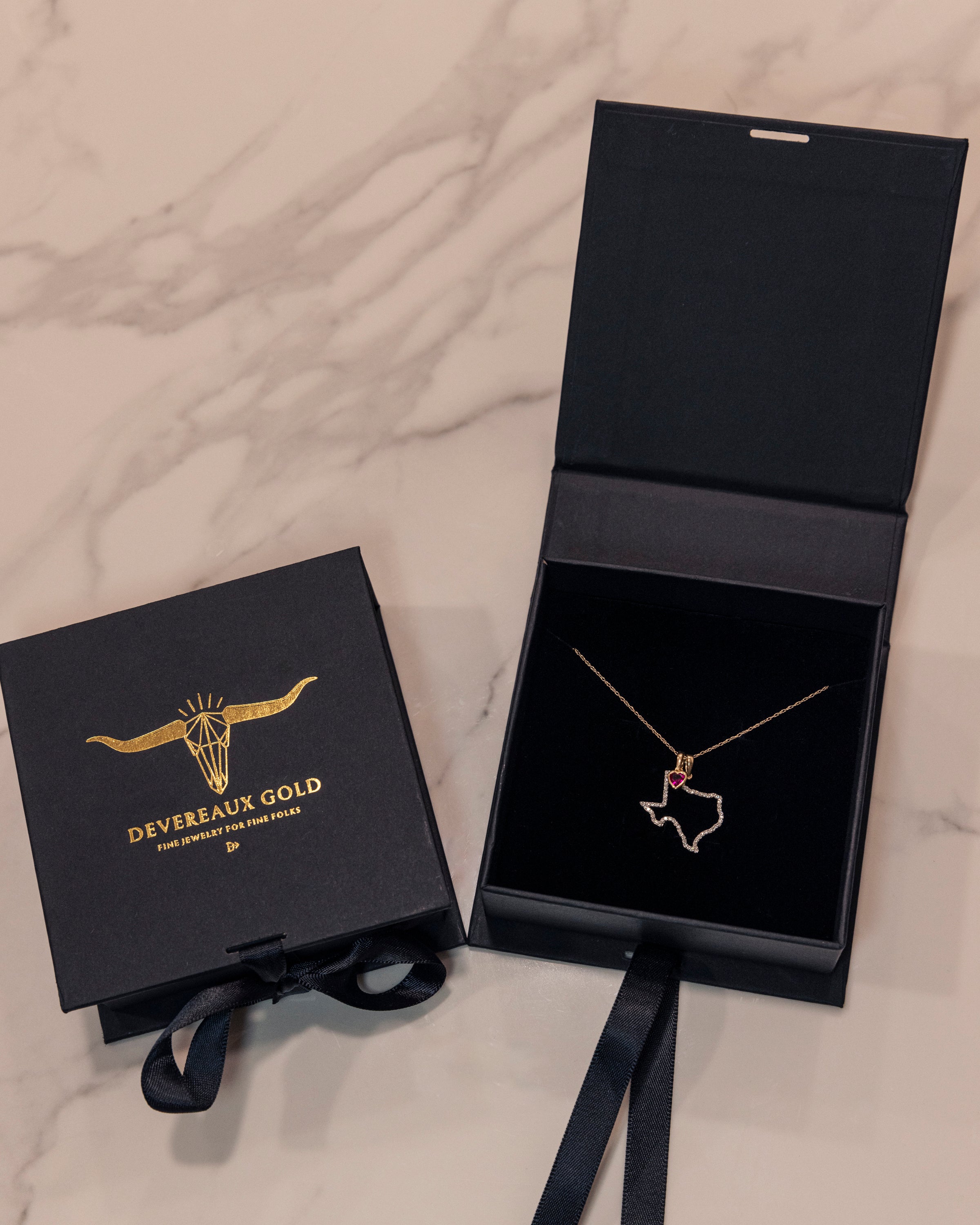 Heart of Texas - State of Texas Diamond Pendant Necklace with heart shaped created ruby heart in Devereaux Gold Packaging